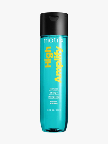 Matrix High Amplify Volumizing Shampoo teal bottle with yellow text and black cap on light gray background
